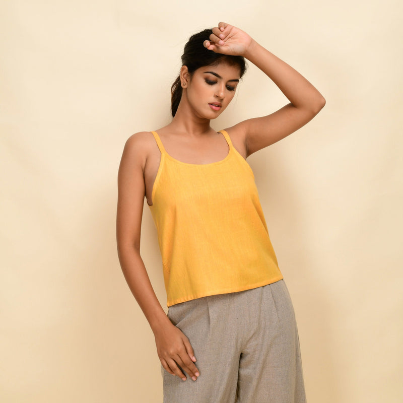 Front View of a Model wearing Yellow 100% Cotton Relaxed Fit Spaghetti Top