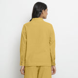 Back View of a Model wearing Vegetable Dyed Yellow Button-Down Cotton Top