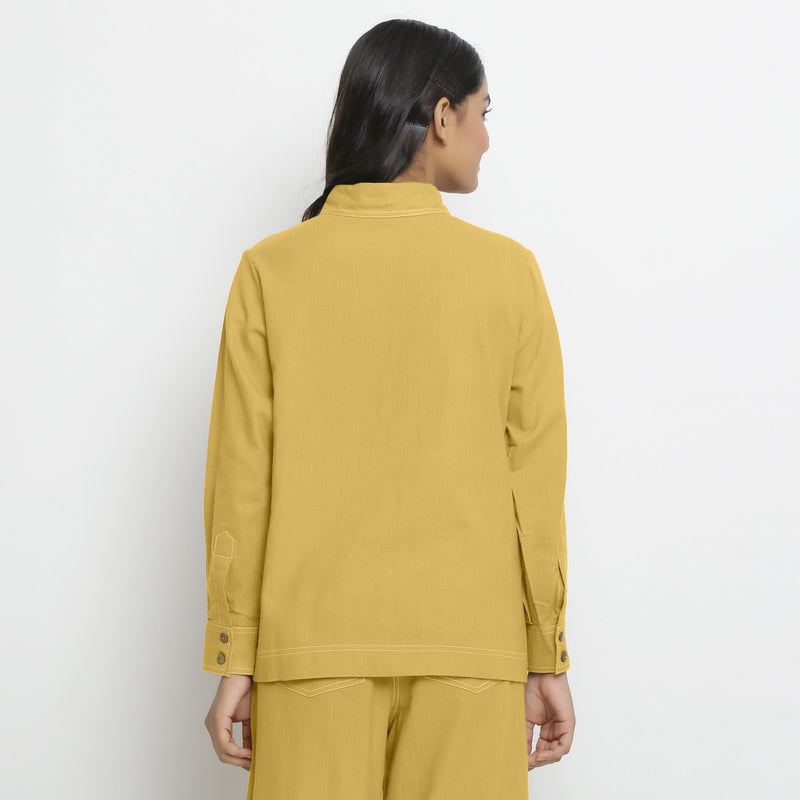 Back View of a Model wearing Vegetable Dyed Yellow Button-Down Cotton Top