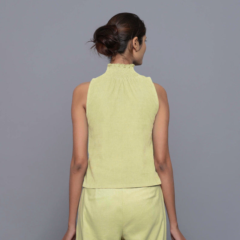 Back View of a Model wearing Yellow Pistachio Cotton Corduroy High Neck Top