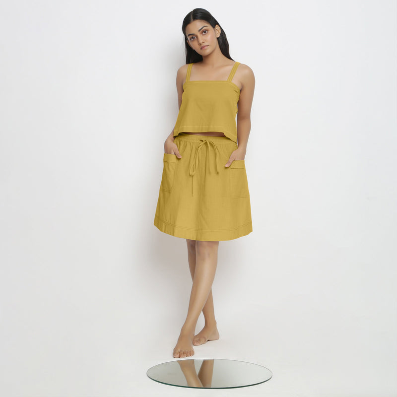 Front View of a Model wearing Yellow Spaghetti Top and Mid-Rise Skirt Set