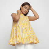 Front View of a Model Wearing Yellow Tiered Hand Screen Printed Top