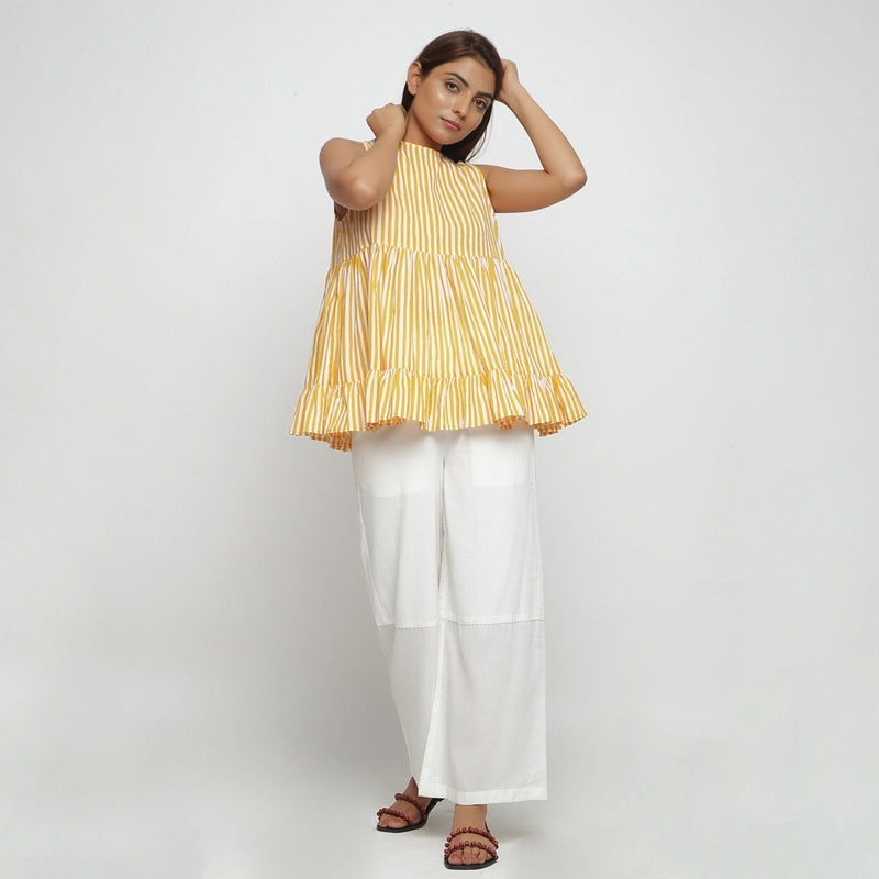 Front View of a Model Wearing Yellow Tiered Top and Wide Legged Pant Set